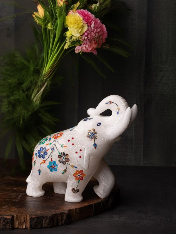 Inlaid marble elephant facing upward